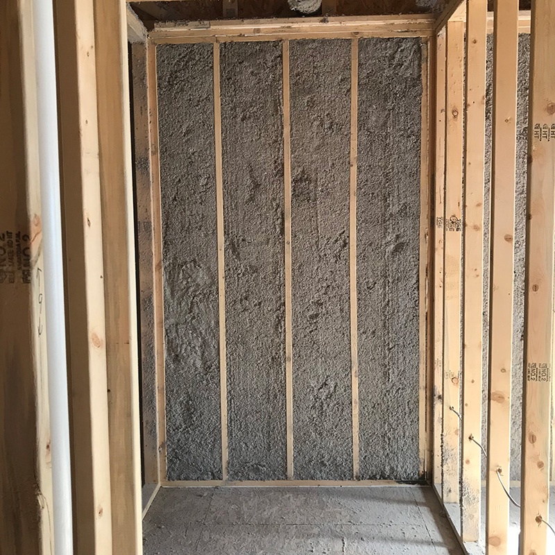 Wet cellulose insulation installed in exterior home wall