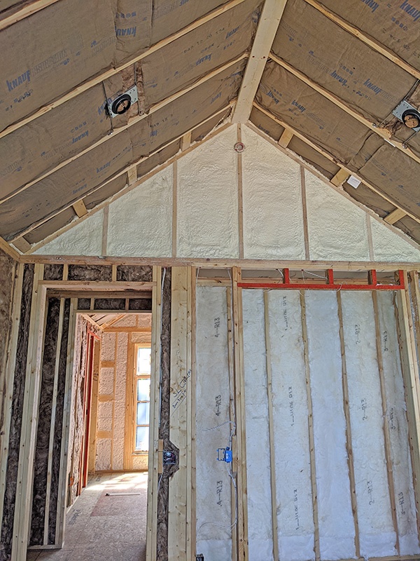 Fiberglass insulation installed in ceilings and interior walls for sound control