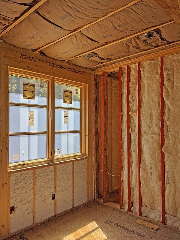 Fiberglass insulation installed in ceilings and interior walls for sound control
