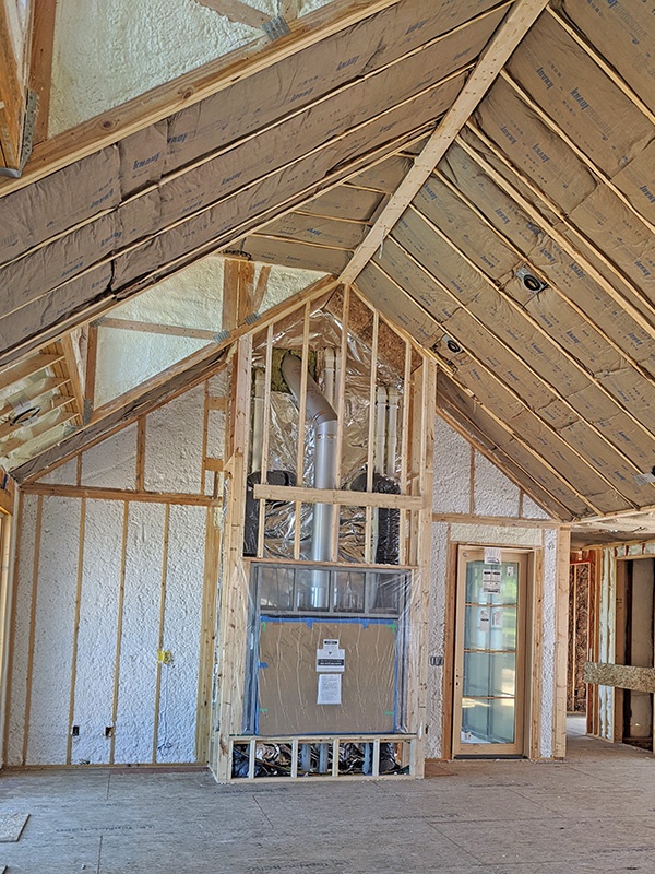 Spray foam and fiberglass insulation in a new home