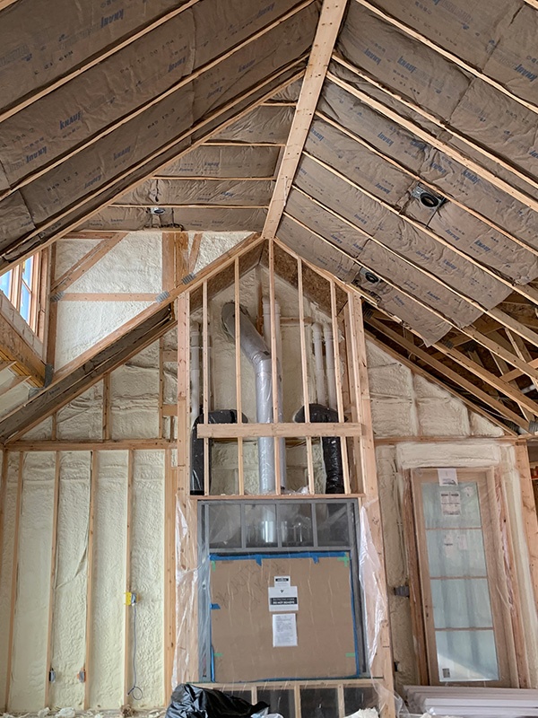 Spray foam and fiberglass insulation in new construction home