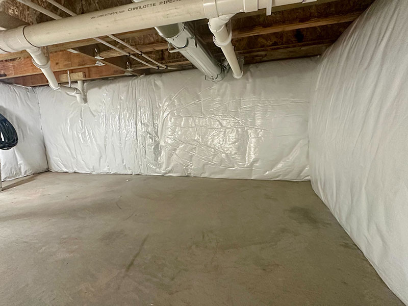 Whitson Insulation installed an R-19 vinyl basement blanket in a Northport, MI new construction crawlspace—boosting energy efficiency and moisture control.