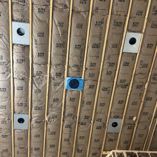 Vaulted sanctuary ceiling insulated with R38 fiberglass batts during a church addition in Walker, MI.
